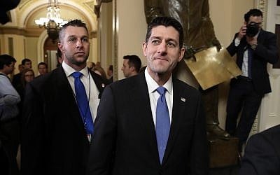 House Speaker Paul Ryan, a Wisconsin Republican, center, leaves the House Chamber after voting on the Republican tax bill, Tuesday, Dec. 19, 2017, on Capitol Hill in Washington. (AP Photo/Jacquelyn Martin)