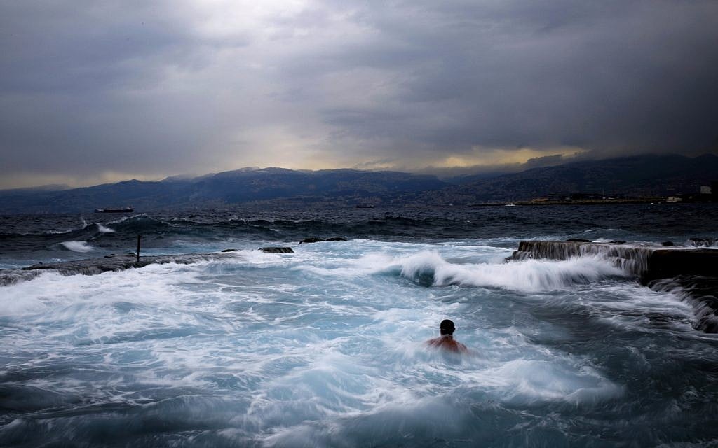Men swimming during an early morning swim in the Mediterranean sea in cool temperatures of 8 degrees celsius, (46.4 Fahrenheit), across Beirut, Lebanon, February 16, 2017. (AP Photo/Hassan Ammar)