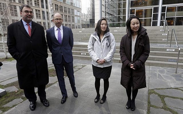 Mariko Hirose, right, a litigation director at the Urban Justice Center, Esther Sung, a staff attorney at the National Immigration Law Center, Rabbi Will Berkowitz, Jewish Family Service of Seattle CEO and Mark Hetfield, president and CEO of HIAS, stand in front of a federal courthouse after speaking with media members there Thursday, Dec. 21, 2017, in Seattle. (AP Photo/Elaine Thompson) Mariko Hirose, right, a litigation director at the Urban Justice Center, Esther Sung, a staff attorney at the National Immigration Law Center, Rabbi Will Berkowitz, Jewish Family Service of Seattle CEO and Mark Hetfield, president and CEO of HIAS, stand in front of a federal courthouse after speaking with media members there Thursday, Dec. 21, 2017, in Seattle. (AP Photo/Elaine Thompson)