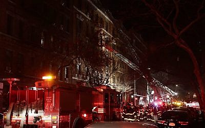 Illustrative image of New York firefighters responding to a building fire in the Bronx borough of New York on December 28, 2017. (AP/Frank Franklin II)