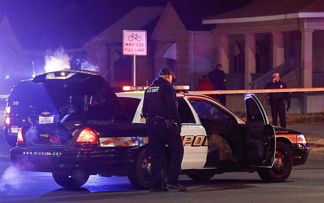 Wichita police investigate a call of a possible hostage situation near the corner of McCormick and Seneca in Wichita, Kansas on December 28, 2017. (Fernando Salazar/The Wichita Eagle via AP) Wichita police investigate a call of a possible hostage situation near the corner of McCormick and Seneca in Wichita, Kansas on December 28, 2017. (Fernando Salazar/The Wichita Eagle via AP)