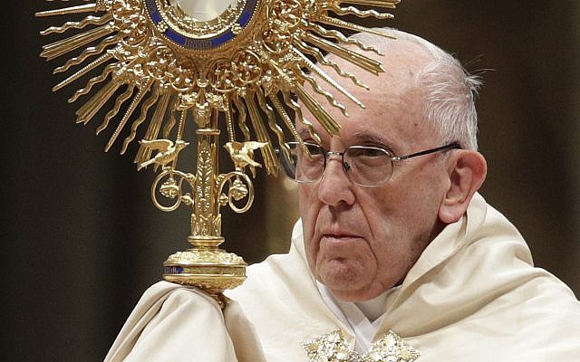 Pope Francis holds a monstrance, as he celebrates a New Year's Eve vespers Mass in St. Peter's Basilica at the Vatican, Sunday, December 31, 2017. (AP Photo/Andrew Medichini) Pope Francis holds a monstrance, as he celebrates a New Year's Eve vespers Mass in St. Peter's Basilica at the Vatican, Sunday, December 31, 2017. (AP Photo/Andrew Medichini)