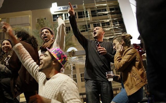 Israelis cheer at a New Year's Eve celebration in central Tel Aviv. (AP Photo/Ariel Schalit/File) Israelis cheer at a New Year's Eve celebration in central Tel Aviv. (AP Photo/Ariel Schalit/File)
