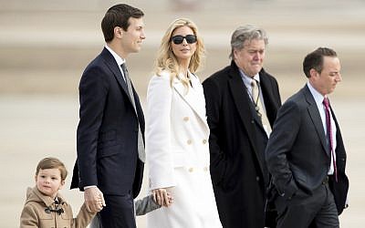 Ivanka Trump, daughter of President Donald Trump, her husband, senior adviser Jared Kushner, their two children Arabella Kushner and Joseph Kushner, Chief White House Strategist Steve Bannon, second from right, and Chief of Staff Reince Priebus, right, walk to Air Force One at Andrews Air Force Base in Md., Friday, Feb. 17, 2017. (AP Photo/Andrew Harnik)