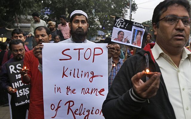 Human rights activists walk during a protest against the reported brutal killing of a Muslim laborer in the Indian western Rajasthan state, India, December 8, 2017. (AP Photo/Bikas Das) Human rights activists walk during a protest against the reported brutal killing of a Muslim laborer in the Indian western Rajasthan state, India, December 8, 2017. (AP Photo/Bikas Das)