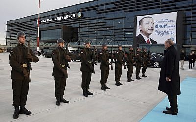 Turkey's President Recep Tayyip Erdogan inspects a military honor guard as he arrives to address a party meeting in Sinop, Turkey, Saturday, December 30, 2017. (Yasin Bulbul/Pool  via AP)