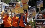 Palestinian activists hold posters during a demonstration calling for a boycott of Israeli products in the West Bank city of Nablus, file (AP Photo/Nasser Ishtayeh)