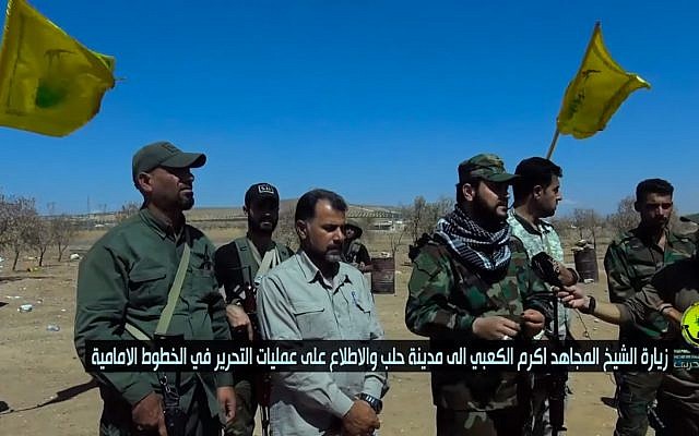 Al-Nojaba militia chief Akram al-Kaabi (c-r) in 2016. (Screen capture: YouTube)