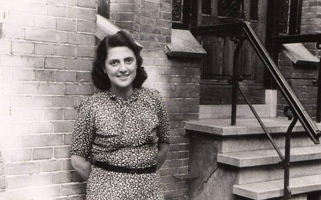 Alice Cohn poses in front of the building in which she hid from the Nazis, in Utrecht, the Netherlands. The photo was taken after the liberation of Europe in 1945. (Courtesy: National Holocaust Museum)