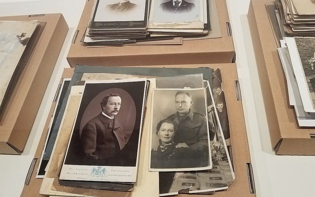 At the National Holocaust Museum in Amsterdam, the Netherlands, an exhibit on the creation of Nazi-era forgeries includes headshots of Dutch men and women  as used by the national population registry, December 2017. (Matt Lebovic/The Times of Israel)