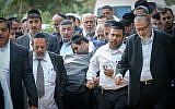 Thousands mourning the deceased members of the Azan family at a funeral in Holon, Israel, December 20, 2017. (Flash90 via JTA)