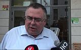 Coalition chair David Bitan leaves his home on his way to be questioned by police on suspicion of corruption, December 6, 2017. (Screen capture: Ynet)