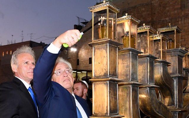 US Ambassador to Israel David Friedman lights the menorah at the Western Wall in Jerusalem, December 13, 2017. (Courtesy) US Ambassador to Israel David Friedman lights the menorah at the Western Wall in Jerusalem, December 13, 2017. (Courtesy)