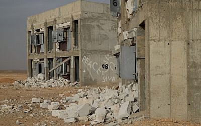 The remains of blast tests on building materials in the army's Sayarim Base in the Arava desert in southern Israel on December 27, 2017. (Judah Ari Gross/Times of Israel)