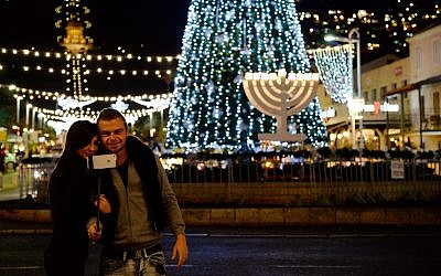 Celebrating the Holiday of Holidays, the cross-section of Hanukkah, Christmas and Id al-Adha in Haifa (Sapir Bronzberg/Flash 90)