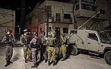 Illustrative: Israeli soldiers who accompanied worshipers to the tombs of Joshua Bin Nun and Caleb son of Jephunneh in the Palestinian village of Kifl Haris, in the West Bank on May 3, 2016. (Yaakov Naumi/Flash90)