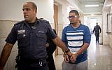 Murad Rajabi, 20-years-old from Silwan is escorted by prison guard into the courtroom at the District Court in Jerusalem on November 3, 2016 (Yonatan Sindel/Flash90)