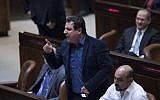 Joint (Arab) List party chairman Ayman Odeh reacts during a plenum session in the assembly hall of the Israeli parliament, January 25, 2017. (Yonatan Sindel/Flash90)