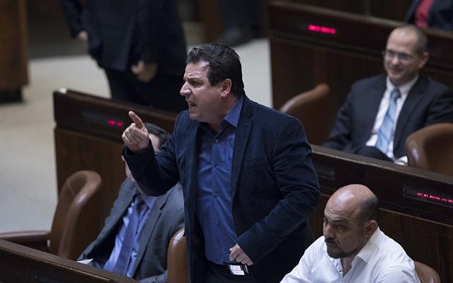 Joint (Arab) List party chairman Ayman Odeh reacts during a plenum session in the assembly hall of the Israeli parliament, January 25, 2017. (Yonatan Sindel/Flash90)