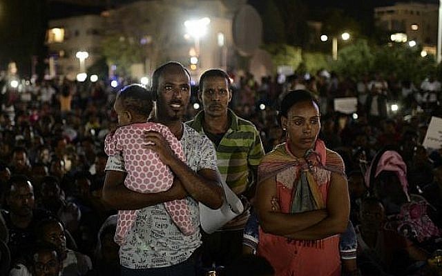 African migrants take part in a protest in Tel Aviv on June 10, 2017,against the 'Deposit Law,' which requires them to deposit 20% of their salary in a fund which they can only take back after they leave the country. (Tomer Neuberg/Flash90) African migrants take part in a protest in Tel Aviv on June 10, 2017,against the 'Deposit Law,' which requires them to deposit 20% of their salary in a fund which they can only take back after they leave the country. (Tomer Neuberg/Flash90)