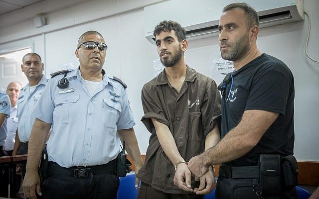 Omar al-Abed (center) is brought to the courtroom for his trial at the Ofer military court near the West Bank city of Ramallah on August 17, 2017. (Yonatan Sindel/Flash90) Omar al-Abed (center) is brought to the courtroom for his trial at the Ofer military court near the West Bank city of Ramallah on August 17, 2017. (Yonatan Sindel/Flash90)