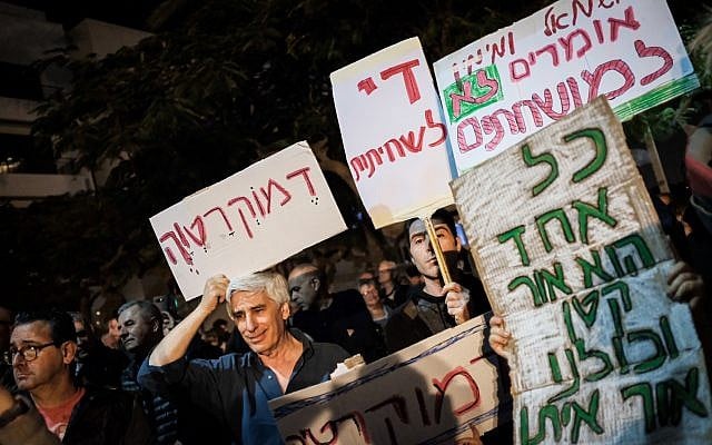 Protesters take part in the anti-corruption 'march of shame' in Tel Aviv on December 2, 2017. (Tomer Neuberg/Flash90) Protesters take part in the anti-corruption 'march of shame' in Tel Aviv on December 2, 2017. (Tomer Neuberg/Flash90)