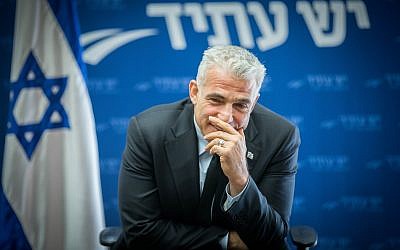 Yesh Atid party leader Yair Lapid leads a Yesh Atid faction meeting at the Knesset, December 11, 2017. (Yonatan Sindel/Flash90)