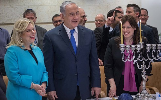 Prime Minister and Foreign Minister Benjamin Netanyahu, his wife Sara, and Deputy Foreign Minister Tzipi Hotovely, take part in Hanukkah candle lighting ceremony at the Foreign Ministry in Jerusalem, on December 12, 2017. (Hadas Parush/Flash90)