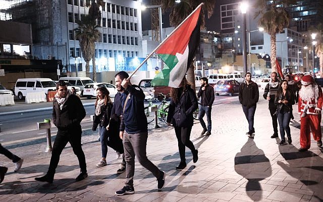 Arab Israelis take part in a protest outside the American embassy in Tel Aviv against US President Donald Trump's decision to recognize Jerusalem as Israel's capital on December 12, 2017. (Tomer Neuberg/Flash90)