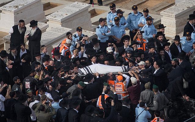Ultra-Orthodox Jewish men carry the body of Rabbi Aharon Leib Steinman during his funeral in the Bnei Brak, on December 12, 2017. (Yonatan Sindel/Flash90) Ultra-Orthodox Jewish men carry the body of Rabbi Aharon Leib Steinman during his funeral in the Bnei Brak, on December 12, 2017. (Yonatan Sindel/Flash90)