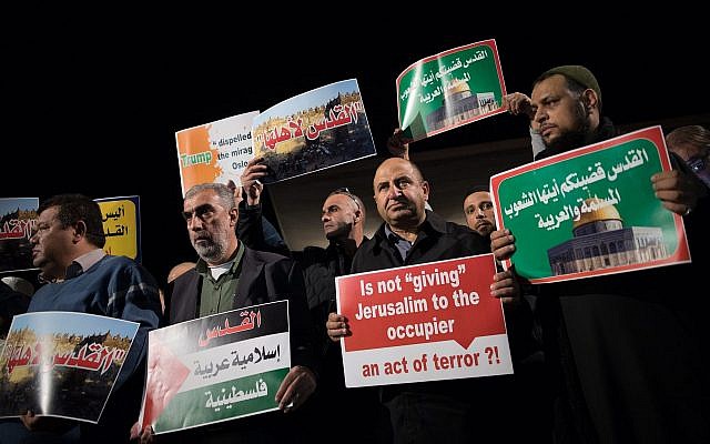 Arab Israelis take part in a protest outside the American embassy in Tel Aviv against US President Donald Trump's decision to recognize Jerusalem as Israel's capital on December 12, 2017. (Yonatan Sindel/Flash90)