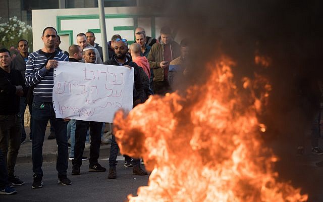 Teva workers protest against company plan to lay off hundreds of employees by blocking the Begin highway in Jerusalem, December 17, 2017. Yonatan Sindel/Flash90) Teva workers protest against company plan to lay off hundreds of employees by blocking the Begin highway in Jerusalem, December 17, 2017. Yonatan Sindel/Flash90)