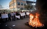 Workers of the Teva company protest against the company plan to lay off hundreds of employees, outside the TEVA Pharmaceutical Industries building in Jerusalem, December 14, 2017. (Yonatan Sindel/Flash90)