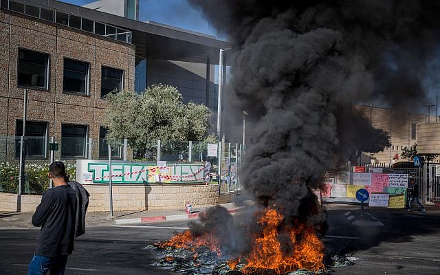 Workers of the Teva company protest against a plan to lay off hundreds of employees, outside the TEVA Pharmaceutical Industries building in Jerusalem, December 17, 2017. (Noam Revkin Fenton/Flash90) Workers of the Teva company protest against a plan to lay off hundreds of employees, outside the TEVA Pharmaceutical Industries building in Jerusalem, December 17, 2017. (Noam Revkin Fenton/Flash90)