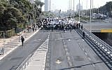 Workers of the Teva company protest against the company plan to lay off hundreds of employees, in Petah Tikva, December 17, 2017. (Tomer Neuberg/Flash90)