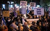 Israelis hold signs and shout slogans during a rally against corruption in government, at Zion Square in Jerusalem on December 23, 2017. (Hadas Parush/Flash90)