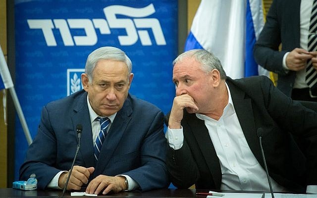 Prime Minister Benjamin Netanyahu (left) and coalition chairman David Amsalem converse during a Likud faction meeting at the Knesset on December 25, 2017. (Miriam Alster/Flash90) Prime Minister Benjamin Netanyahu (left) and coalition chairman David Amsalem converse during a Likud faction meeting at the Knesset on December 25, 2017. (Miriam Alster/Flash90)