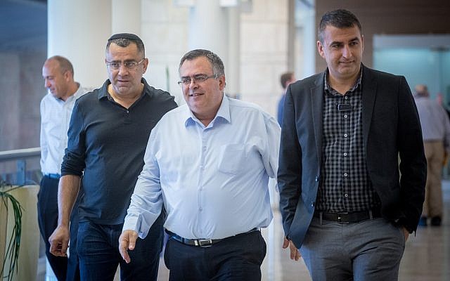 MK David Bitan, center, arrives at a Likud party faction meeting at the Knesset on December 25, 2017. (Miriam Alster/Flash90) MK David Bitan, center, arrives at a Likud party faction meeting at the Knesset on December 25, 2017. (Miriam Alster/Flash90)