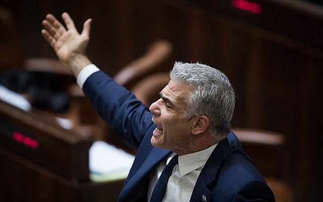 Knesset Member Yair Lapid reacts during a marathon plenary session in the Knesset regarding the "Recommendations Bill" on December 27, 2017. (Hadas Parush/Flash90) Knesset Member Yair Lapid reacts during a marathon plenary session in the Knesset regarding the "Recommendations Bill" on December 27, 2017. (Hadas Parush/Flash90)