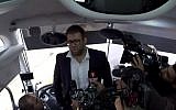 Likud MK Oren Hazan boards a bus carrying family members of Gazans being held in Israeli military prison, December 25, 2017. (Screen capture: Israel Hayom)