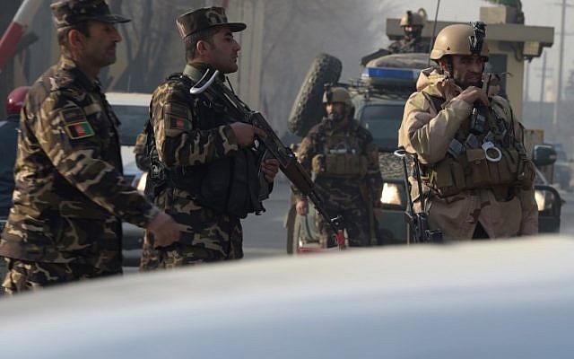 Afghan security personnel block a road near the site of a suicide attack in Kabul on December 25, 2017. (AFP PHOTO / Shah MARAI) Afghan security personnel block a road near the site of a suicide attack in Kabul on December 25, 2017. (AFP PHOTO / Shah MARAI)