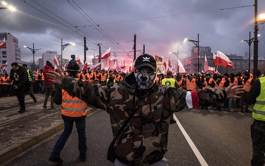 A man with his face covered as thousands gather for the annual nationalist march of Poland´s Independency Day in Warsaw, Poland on November 11, 2017. (Lorena de la Cuesta/SOPA Images/LightRocket via Getty Images via JTA) A man with his face covered as thousands gather for the annual nationalist march of Poland´s Independency Day in Warsaw, Poland on November 11, 2017. (Lorena de la Cuesta/SOPA Images/LightRocket via Getty Images via JTA)