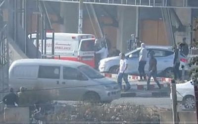 Screen capture from video of a Palestinian Red Crescent ambulance apparently bringing masked protesters to a demonstration in the West Bank, December 11, 2017. (IDF spokesperson)
