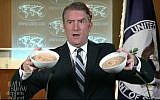 A "State Department spokesman" holds up two bowls of hummus during a sketch poking fun at US President Donald Trump's recognition of Jerusalem as Israel's on "The Late Show with Stephen Colbert" aired on December 7, 2017. (Screen capture: YouTube)