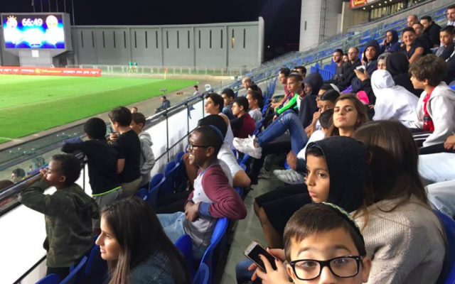 Children from Bet Elazraki Children´s Home and Neve Michael Children's Village at a Hapoel Ra'anana AFC soccer game against Hapoel Tel Aviv FC. (Courtesy, Sharing Seats Israel) Children from Bet Elazraki Children´s Home and Neve Michael Children's Village at a Hapoel Ra'anana AFC soccer game against Hapoel Tel Aviv FC. (Courtesy, Sharing Seats Israel)