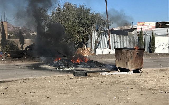 Palestinians in West Bank village of Hawara clash with IDF forces on December 8, 2017, during riots over US President Donald Trump's recognition of Jerusalem as Israel's capital on December 8, 2017. (Jacob Magid/Times of Israel) Palestinians in West Bank village of Hawara clash with IDF forces on December 8, 2017, during riots over US President Donald Trump's recognition of Jerusalem as Israel's capital on December 8, 2017. (Jacob Magid/Times of Israel)