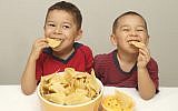Illustrative. Enjoying a bowl of tortilla chips. (Hugh Stonelan via Stock/Getty Images)