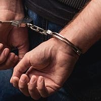 Illustrative. A criminal in handcuffs. (Yakobchuk Olena/ iStock, by Getty Images)