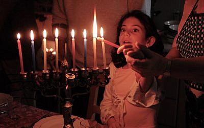 Lighting Hanukkah candles. (Illustrative image via iStock)