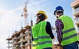 Illustrative photo of managers at a construction site (milanvirijevic, iStock by Getty Images)